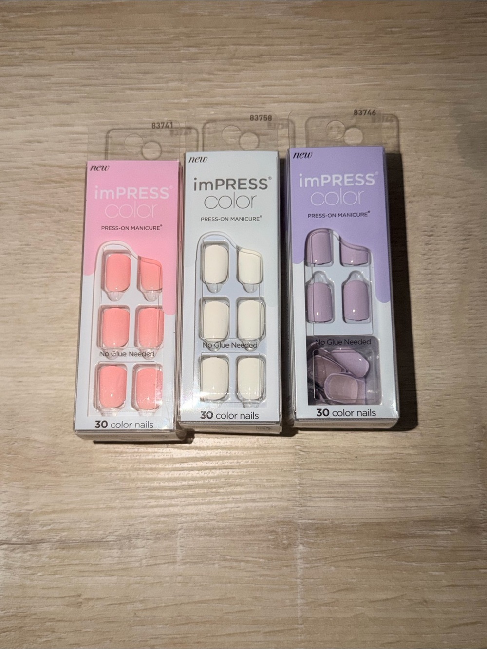 imPRESS Color Press-On Nails in Coral Pink, Cream, and Lavender length: short sq